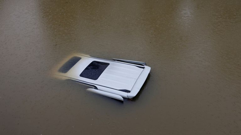 A view of a vehicle submerged at a flooded area after heavy rains, in Hong Kong, China, September 8, 2023. REUTERS/Tyrone Siu
