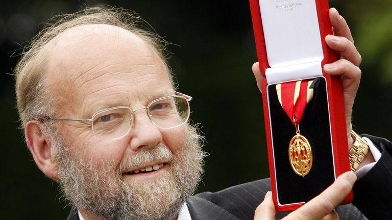  Sir Ian Wilmut with his knighthood after it was presented to him by Queen Elizabeth II at the Palace of Holyrood House