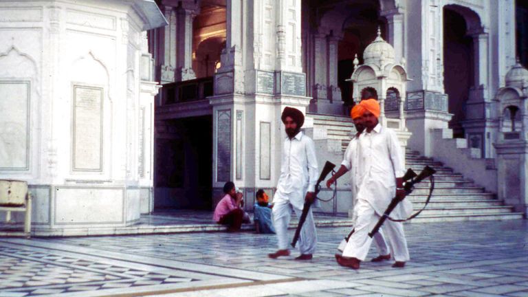 Sikhs carry rifles at the Golden Temple complex in May 1984. Pic: AP