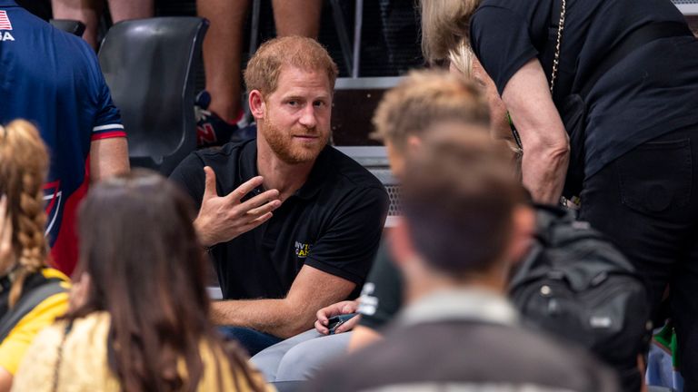Prince Harry, Duke of Sussex, talks to participants and officials at the 6th Invictus Games. Pic: AP