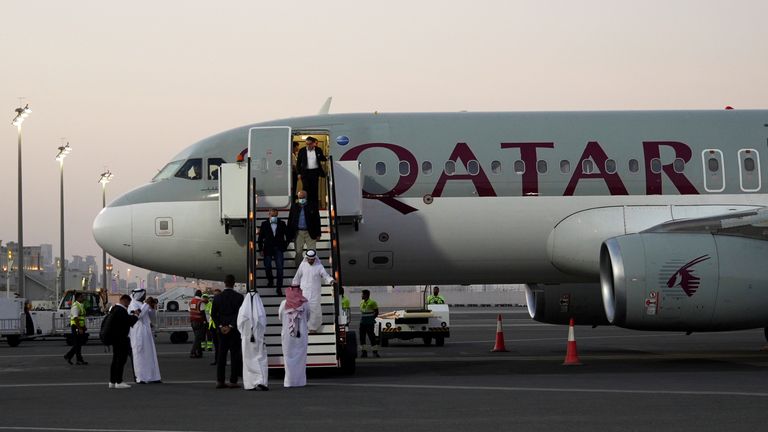 Emad Sharghi, Morad Tahbaz and Siamak Namazi, former prisoners in Iran, walk out of a Qatar Airways flight that brought them out of Tehran and to Doha, Qatar, Monday, Sept. 18, 2023. Five prisoners sought by the U.S. in a swap with Iran were freed Monday and headed home as part of a deal that saw nearly $6 billion in Iranian assets unfrozen. (AP Photo/Lujain Jo)