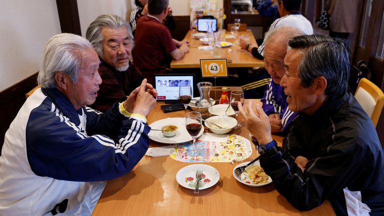 Members of in Tokyo football team where the players’ average age is 65-year-old