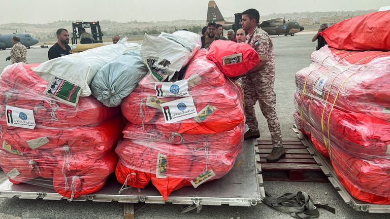 Jordanian military personnel arranges relief items from the Jordan Hashemite Charity Organization