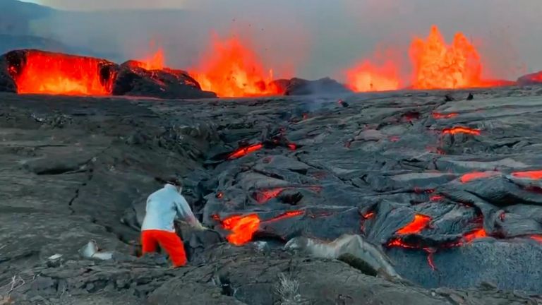 Geologist takes a lava sample from Kilauea