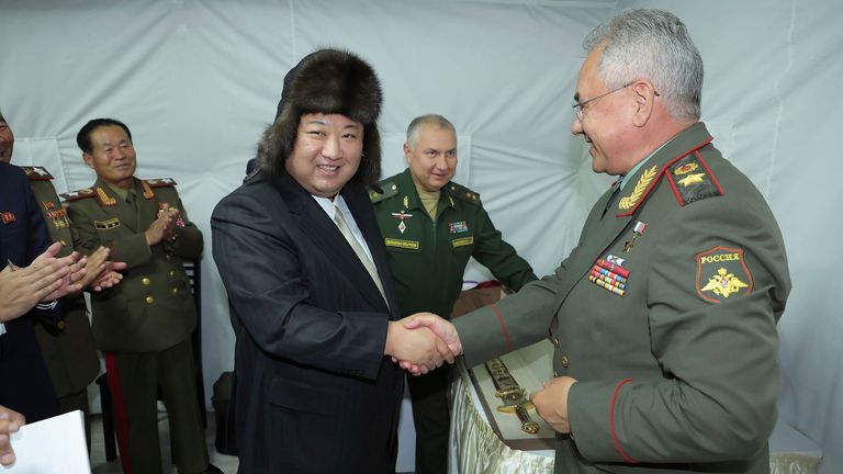 Kim Jong Un receives a gift from Russian defense minister Sergei Shoigu during his visit to the  Russian Pacific fleet in Vladivostok. Pic: AP