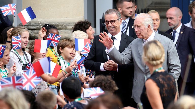 King Charles and Queen Camilla met by hundreds of cheering fans waving ...