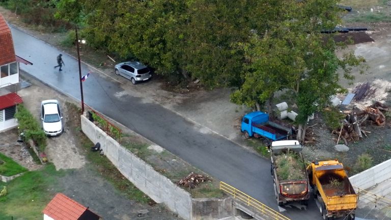 Two trucks without license plates block a bridge near Banjska Monastery
