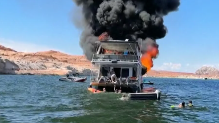 A family houseboat went up in flames in Lake Powell, US. Credit: Maddy Tolman