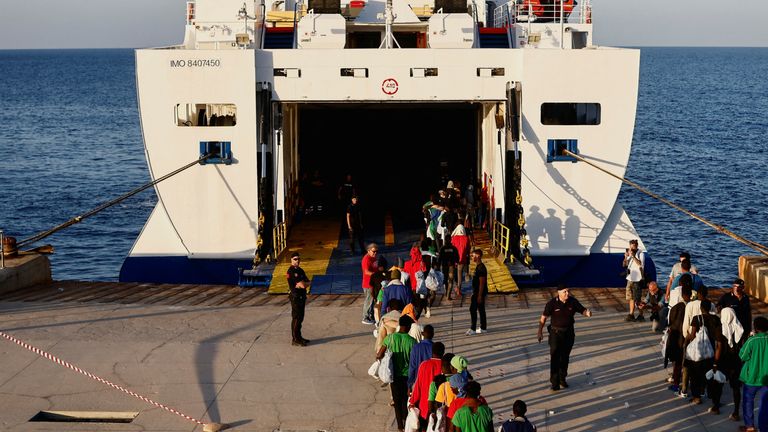 Migrants board a ship to be transferred to the mainland, on the Sicilian island of Lampedusa, Italy, September 15, 2023. REUTERS/Yara Nardi
