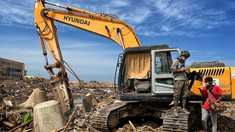 Diggers searching through the rubble