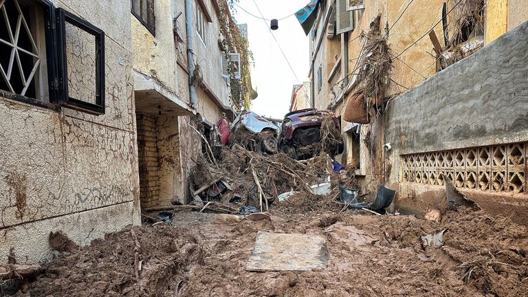 Streets were strewn with mud and cars