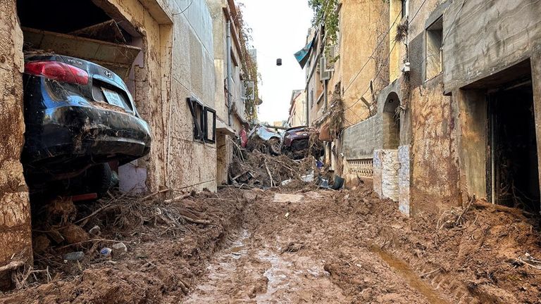 Cars swept away by devastating floods in Derna, Libya