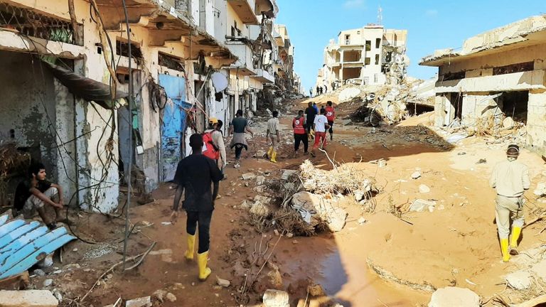 Members of Libyan Red Crescent Ajdabiya work in an area affected by flooding, in Derna, Libya
Pic:Libyan Red Crescent Ajdabiy/Reuters
