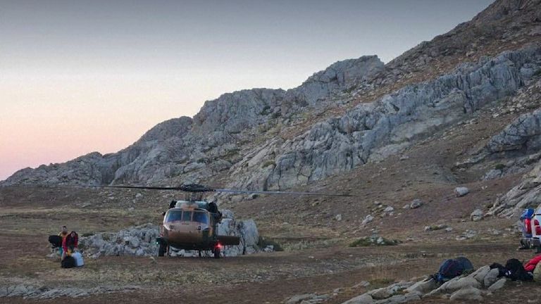 A helicopter pictured close to the entrance to Morca Cave 