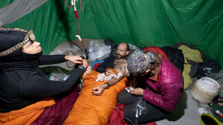 A medical team takes care of American caver Mark Dickey, inside the Morca cave. Pic: AP