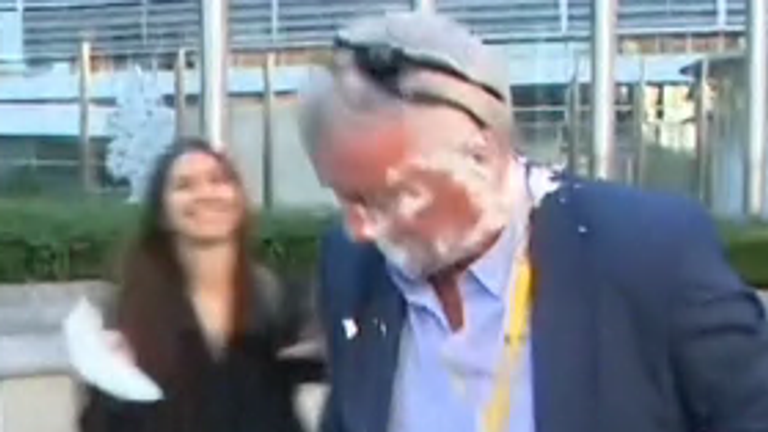 Moment Ryanair CEO is hit with a cake by climate activists.