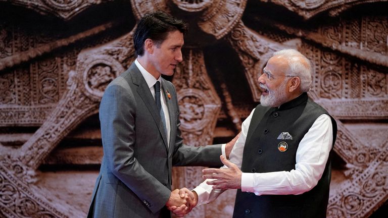 FILE PHOTO: Indian Prime Minister Narendra Modi welcomes Canada Prime Minister Justin Trudeau upon his arrival at Bharat Mandapam convention center for the G20 Summit, in New Delhi, India, Saturday, Sept. 9, 2023. Evan Vucci/Pool via REUTERS/File Photo