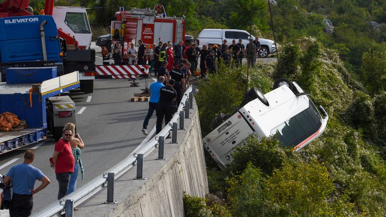The bus, carrying 30 passengers, plunged into the ravine after swerving on a steep road, police said. Pic: AP 