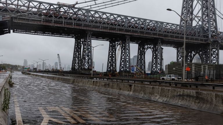 The FDR highway under the Williamsburg Bridge in New York was closed after heavy rain flooded roads