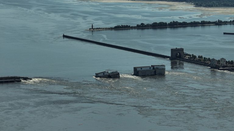 CAPTION CORRECTS LOCATION - Water flows over the collapsed Kakhovka Dam in Nova Kakhovka, in Russian-occupied Ukraine, Wednesday, June 7, 2023. (AP Photo)