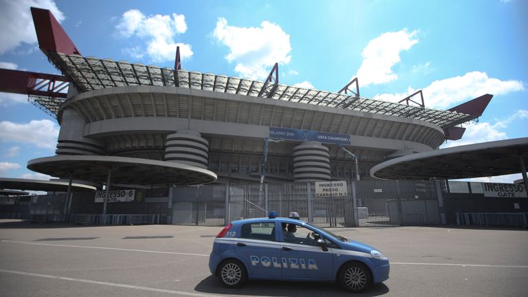 A police car runs next to the San Siro stadium, in Milan, Italy, Monday, May 16, 2016. The Champions League final between Real Madrid and Atletico Madrid will be held at the legendary soccer stadium of AC and Inter Milan, on Saturday, May 28, 2016. (AP Photo/Luca Bruno)


