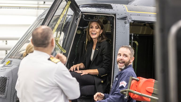 The Princess of Wales jokes with navy personnel as she sits in a training version of a Royal Navy Wildcat helicopter during a visit to the Royal Naval Air Station (RNAS) Yeovilton, near Yeovil in Somerset, one of the Royal Navy's two principal air stations and one of the busiest military airfields in the UK. Picture date: Monday September 18, 2023.