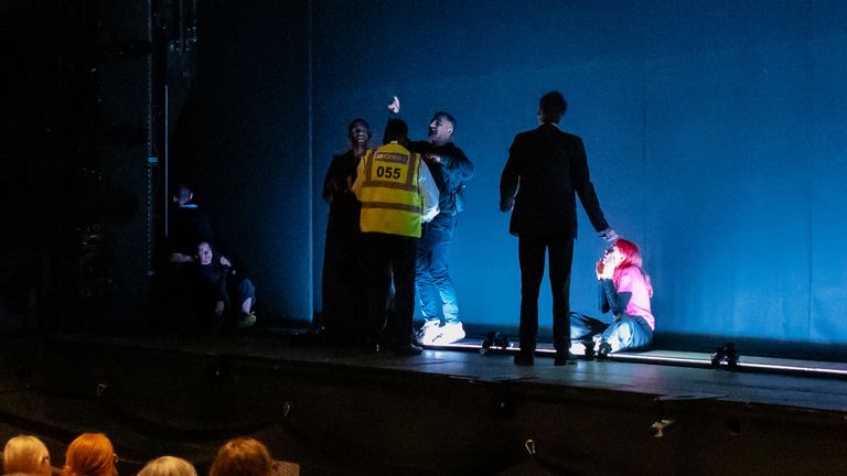 Protesters on stage with security. Pic: Fossil Free London