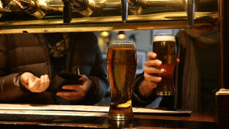 File photo dated 18/04/14 of customers collecting their drinks in a pub, as the UK economy bounced back in April after it was boosted by stronger spending by Britons in pubs, bars and shops.