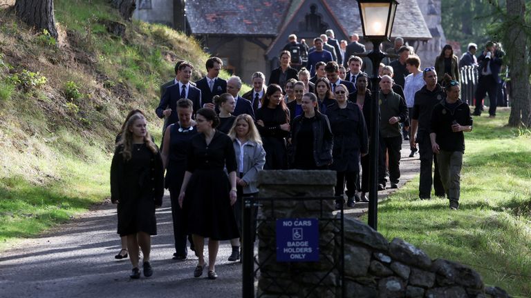 People walk outside Crathie Kirk near Balmoral, Scotland