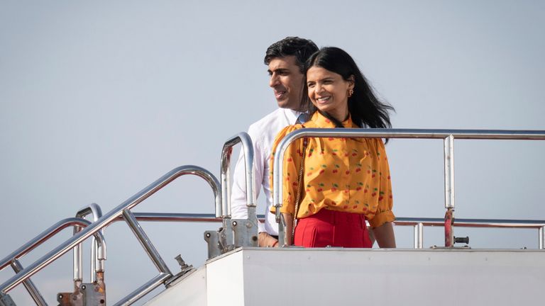 Britain&#39;s Prime Minister Rishi Sunak and his wife Akshata Murty board their plane after attending the -G7 Summit in Hiroshima, Japan Sunday May 21, 2023. (Stefan Rousseau/Pool Photo via AP)