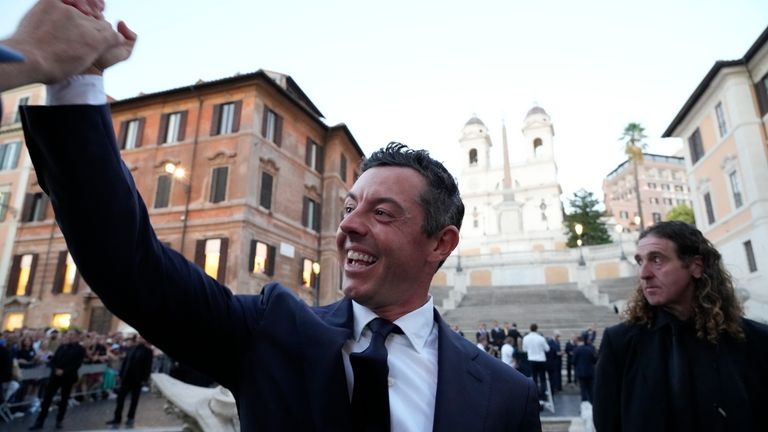 Europe&#39;s Rory Mcilroy shakes hands with a member of the crowd as Members of the European and the United States Ryder Cup teams pose for the cameras on the Spanish Steps in Rome, Italy, Wednesday, Sept. 27, 2023. The Ryder Cup starts Sept. 29, at the Marco Simone Golf Club. (AP Photo/Gregorio Borgia )