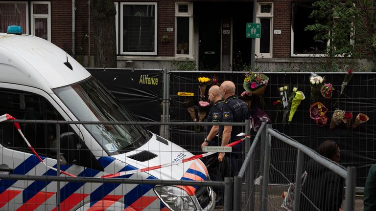 Police officers are seen at the scene of a shooting in Rotterdam, Netherlands, Friday, Sept. 29, 2023. Police in the Netherlands said a lone gunman wearing a bulletproof vest opened fire in an apartment and a hospital in the Dutch port city of Rotterdam, Thursday, Sept. 28, 2023, killing three people, including a 14-year-old girl. (AP Photo/Peter Dejong)