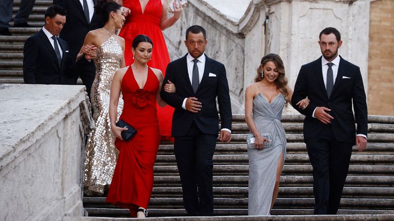 Team USA&#39;s Xander Schauffele and his wife Maya Lowe and Max Homa and his wife Lacey Croom are pictured on the Spanish steps and stairs at Piazza di Spagna in Rome 