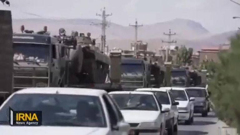 A convoy moves towards Saqqez, the birthplace of Mahsa Amini.