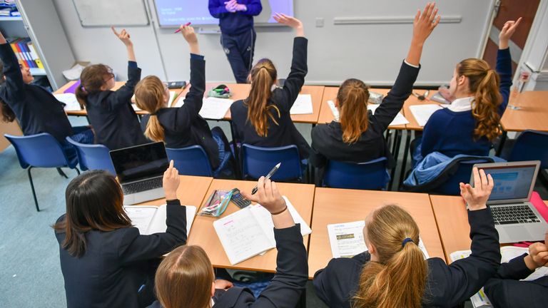 File photo dated 12/09/18 of students raise their hands in class at Royal High School Bath. Labour aims to cut the cost of school uniforms by limiting the number of branded items parents are forced to buy. The party has pledged to strengthen existing statutory guidance in an effort to reduce the burden on families struggling with the cost-of-living crisis. Issue date: Saturday September 2, 2023.
