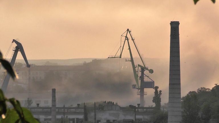 Smoke rises from the shipyard that was reportedly hit by Ukrainian missile attack in Sevastopol, Crimea