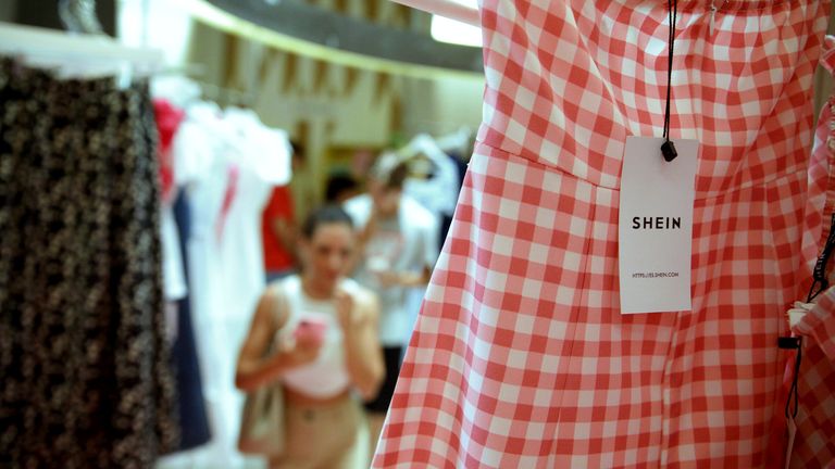 A dress at Shein&#39;s store in Barcelona&#39;s Portal de l&#39;..ngel street on June 30, 2022, in Barcelona, Catalonia, Spain. Shein has opened a &#39;show room&#39; or product showroom in Barcelona to popularize its brand and increase its weight in the Spanish market. The opening of the store has caused queues from six in the morning and customers were able to see and try the clothes, but not buy them at the time, only received a bag with promotional gifts and discounts for their purchases &#39;on line&#39;. The store will be open from today, June 30 until Sunday, July 10. Shein opened another pop-up store in Madrid for four days, with a large influx of customers and the possibility of purchase. 30 JUNE 2022;SHEIN;POP UP;STORE;BARCELONA;FASHION;CLOTHING;PROMOTION;MARKETING;CATALUNYA;ONLINE;APP;DRESS;PLAID DRESS Kike Rinc..n / Europa Press 06/30/2022 (Europa Press via AP)