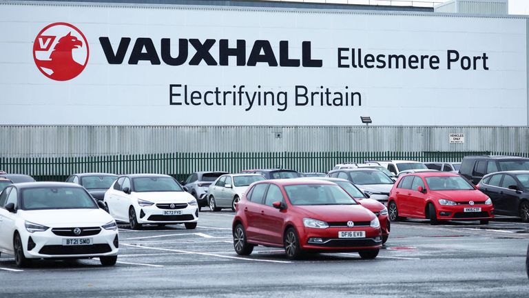 Signage saying  'Electrifying Britain' is seen on the outside of the Stellantis owned Vauxhall car factory in Ellesmere Port 