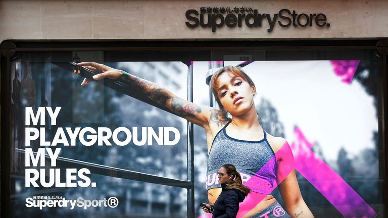 A woman walks past a window display at a Superdry store in London, Britain, March 1, 2019. REUTERS/Toby Melville