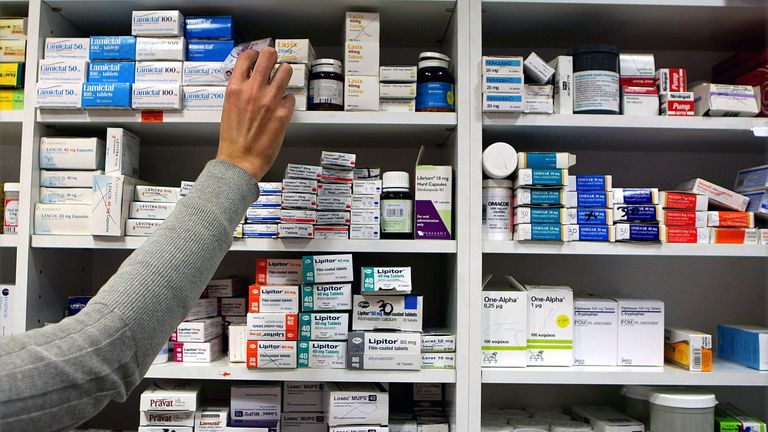 File photo of a pharmacist stocking shelves at a chemist. Taking common painkillers while on the pill may lead to a small increased risk of blood clots, research suggests. Research found the risk was greater in women using ibuprofen, diclofenac and naproxen while on combined pills.
