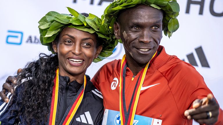 Tigst Assefa and Eliud Kipchoge laughing together after the race. Pic: Andreas Gora/picture-alliance/dpa/AP