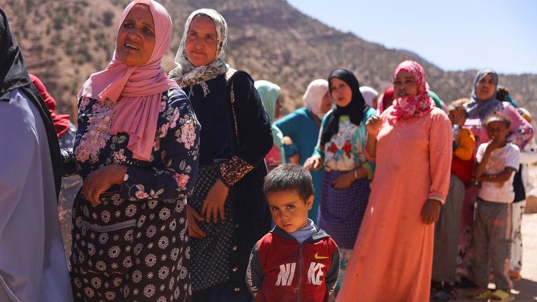 Women and children queue for aid, in the aftermath of a deadly earthquake, in Tinmel, Morocco, September 11, 2023. REUTERS/Hannah McKay
