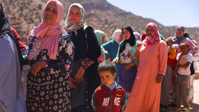 Women and children queue for aid, in the aftermath of a deadly earthquake, in Tinmel, Morocco, September 11, 2023. REUTERS/Hannah McKay
