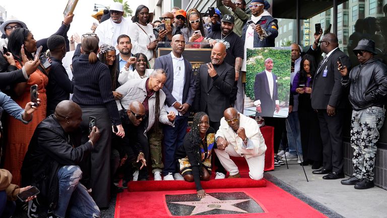 Tupac&#39;s sister Set touches her brother&#39;s star on the Hollywood Walk of Fame. Pic: AP