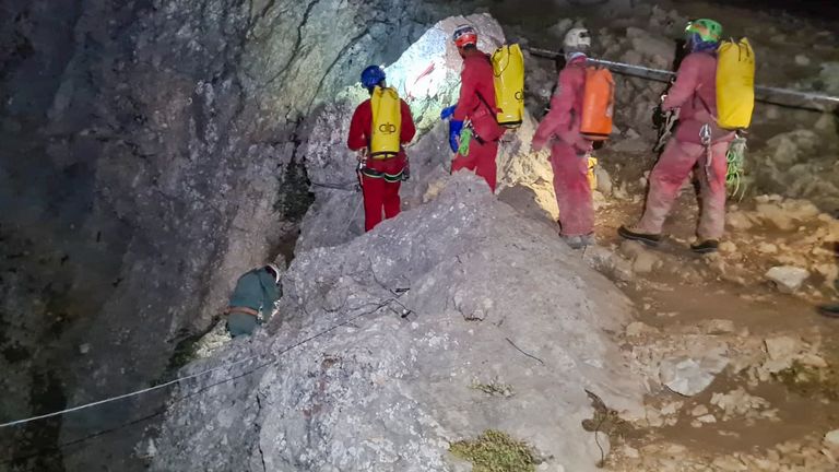 Members of the CNSAS, Italian alpine and speleological rescuers, start to descent on ropes the Morca cave during a rescue operation near Anamur, south Turkey
Pic:CNSAS /AP