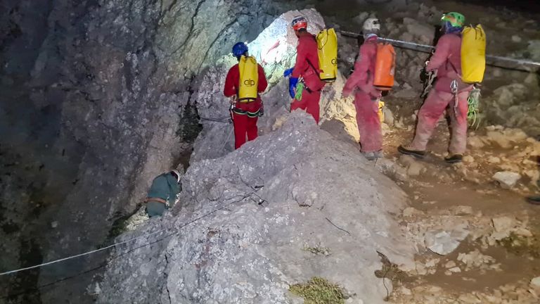 Members of the CNSAS, Italian alpine and speleological rescuers, start to descent on ropes the Morca cave during a rescue operation near Anamur, south Turkey
Pic:CNSAS /AP