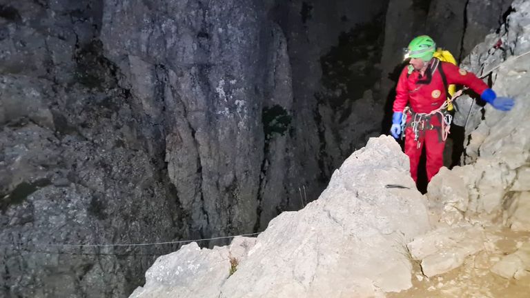 Members of the CNSAS, Italian alpine and speleological rescuers, start to descent on ropes the Morca cave during a rescue operation near Anamur, south Turkey
Pic:CNSAS /AP