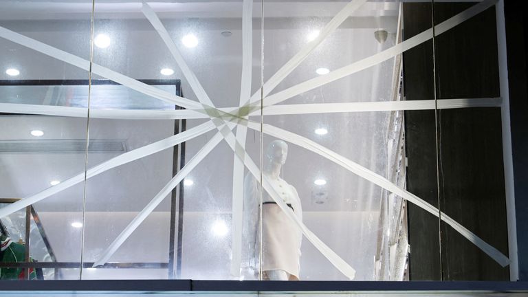 A window is taped in anticipation of typhoon Saola at a boutique in Hong Kong,  