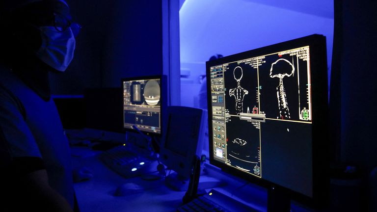 Radiologist technician Guillermo Ramirez examines a CT scan of a tiny body of a specimen, that Mexican journalist and UFO enthusiast Jaime Maussan says is not related to any known Earthly species, at Noor Clinic, in Huixquilucan, Mexico September 18, 2023. REUTERS/Raquel Cunha
