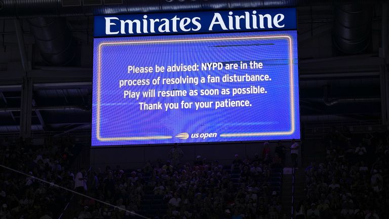 An advisory about a disruption in play is displayed on the large screen inside Arthur Ashe Stadium during play between Karolina Muchova, of the Czech Republic, and Coco Gauff, of the United States, during the women&#39;s singles semifinals of the U.S. Open tennis championships, Thursday, Sept. 7, 2023, in New York. (AP Photo/Manu Fernandez)